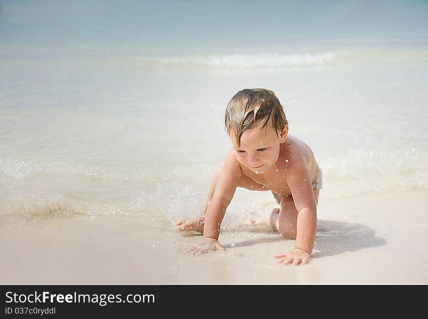 Cute child playing on beach. Cute child playing on beach