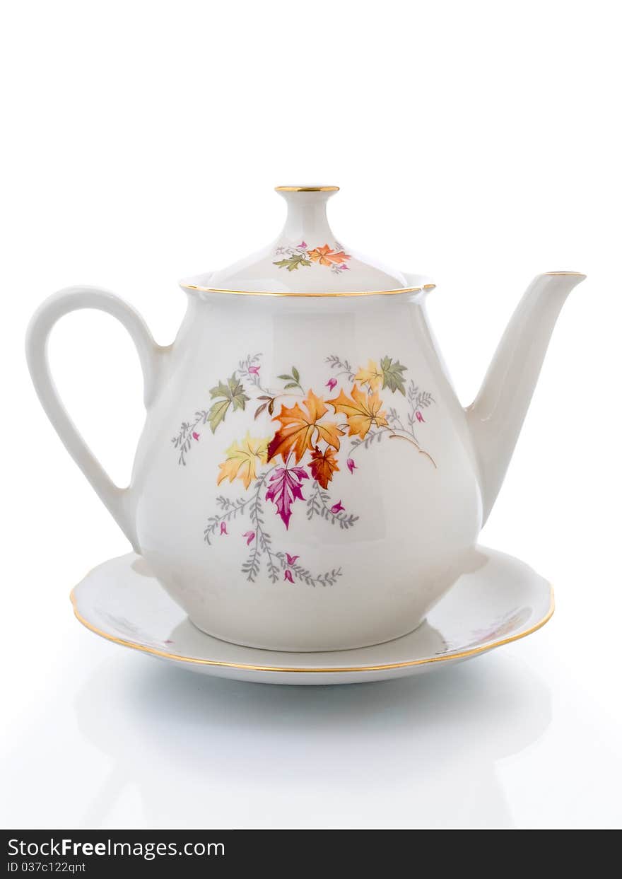 Empty White teapot  on a saucer Isolated