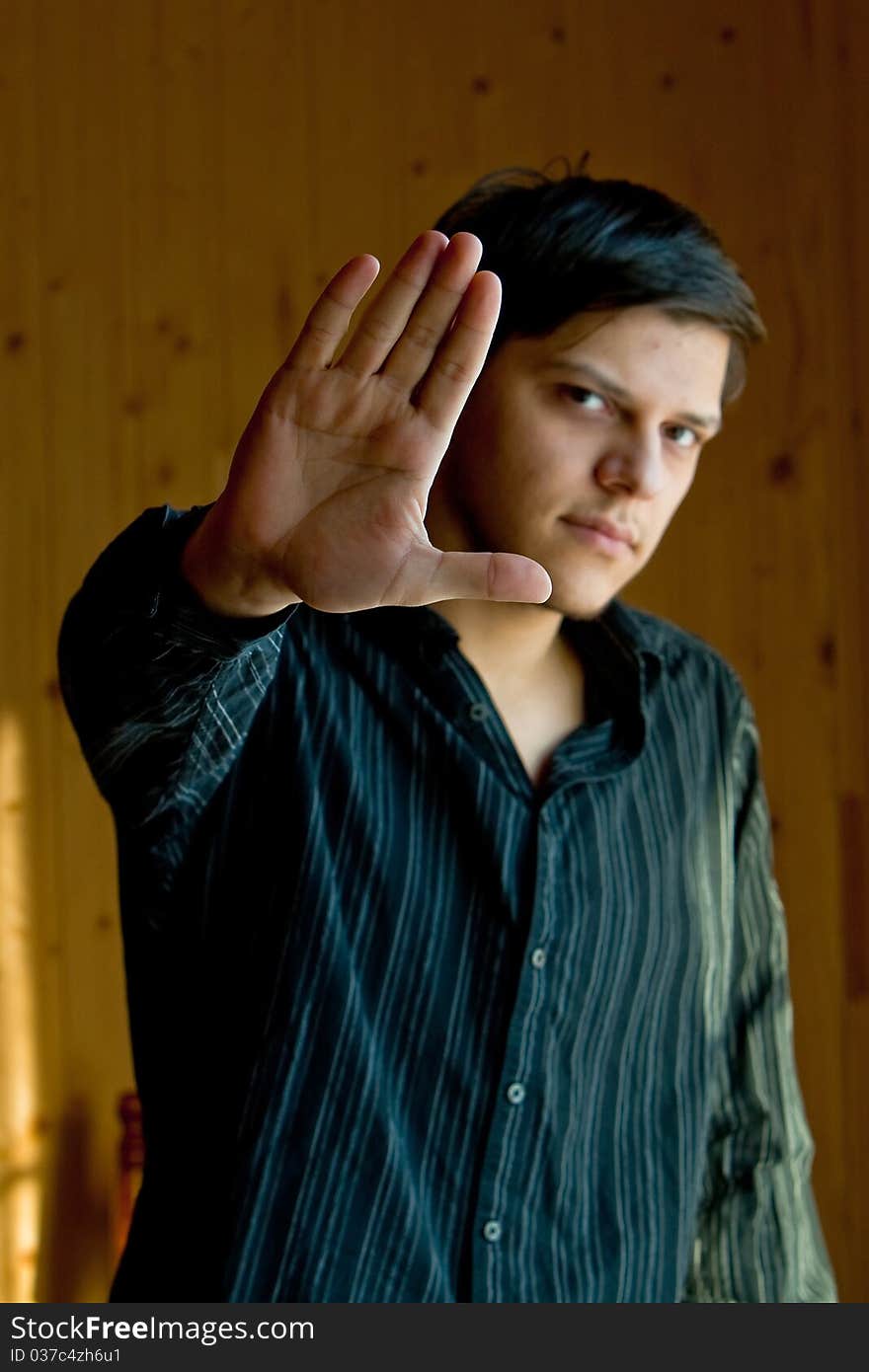 Young Man Showing A Sign