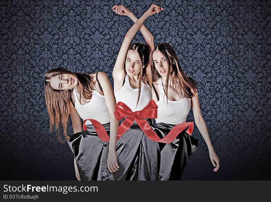 Beauty young womans in gift ribbon