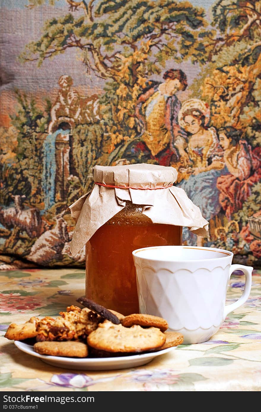 Tea with honey and cookies on flowers pattern