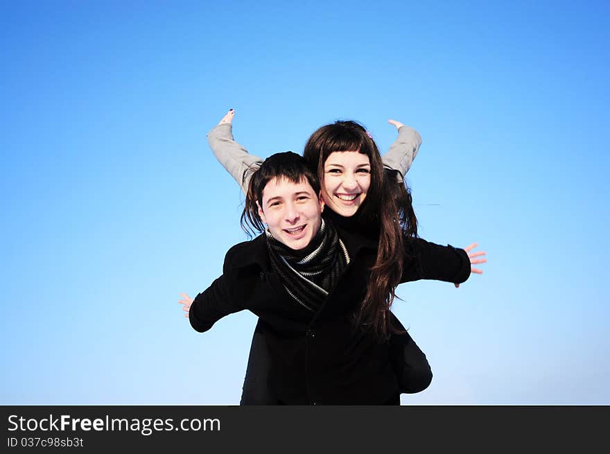 Happy couple on blue sky