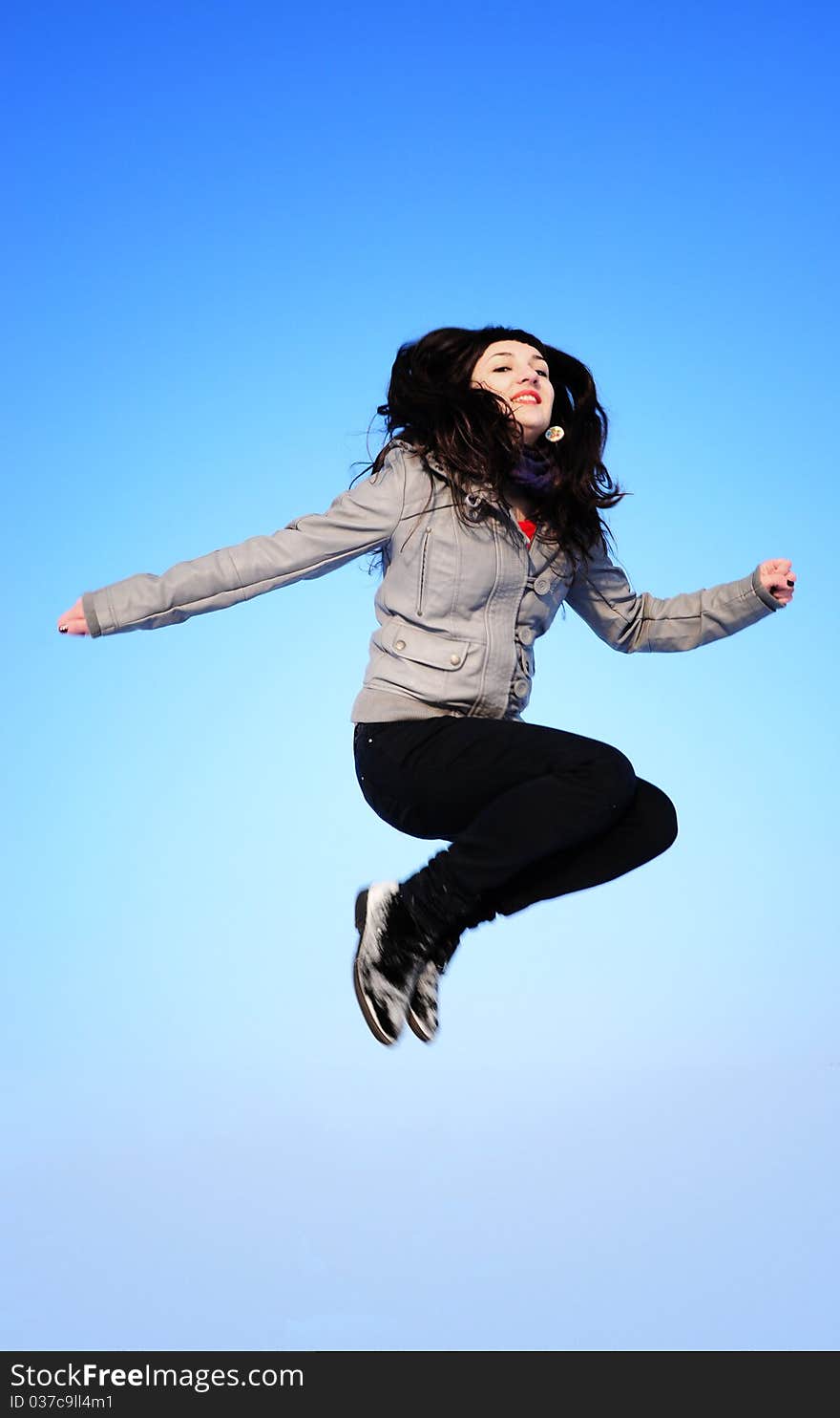 Happy beautiful Jumping Girl on blue sky. Happy beautiful Jumping Girl on blue sky