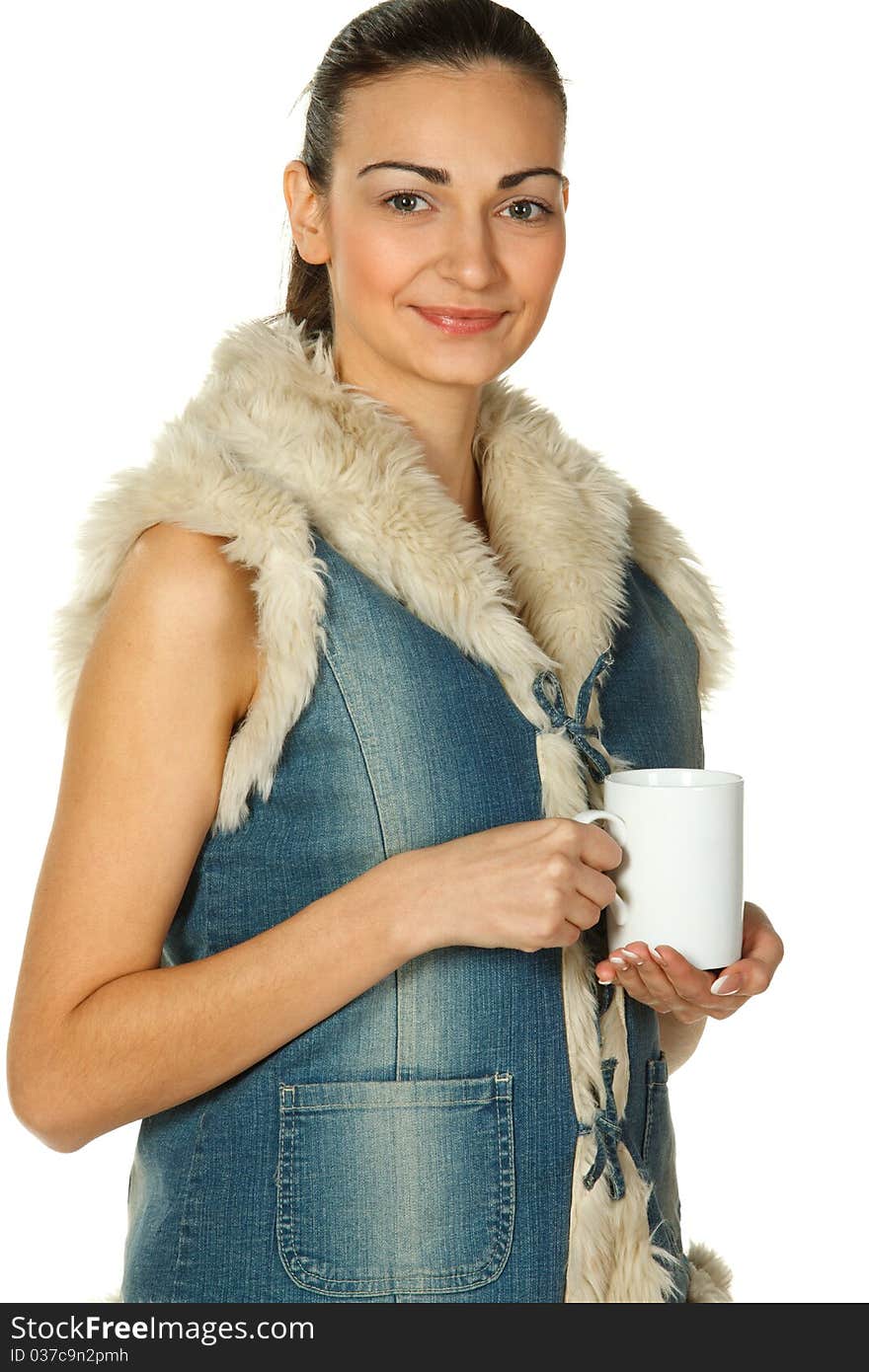 Portrait of beautiful young female in blue denim holding white cup isolated on white. Portrait of beautiful young female in blue denim holding white cup isolated on white