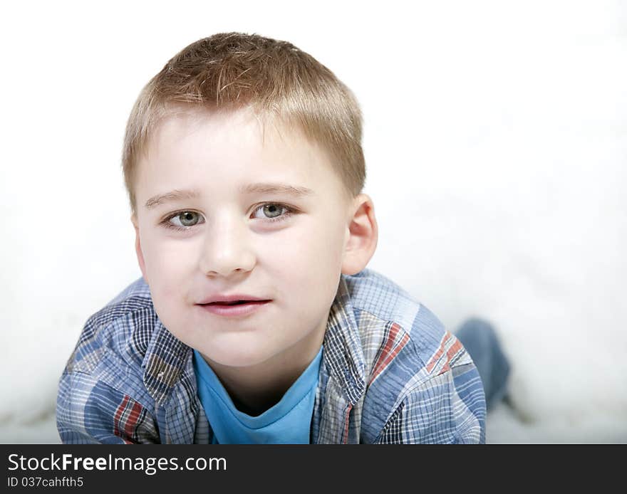 Closeup of a young boy isolated on white background. Closeup of a young boy isolated on white background