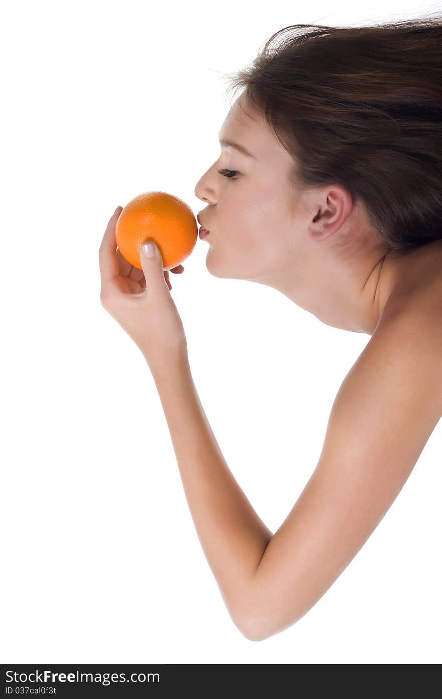 The woman reaches for the orange which holds in his hand, on a white background