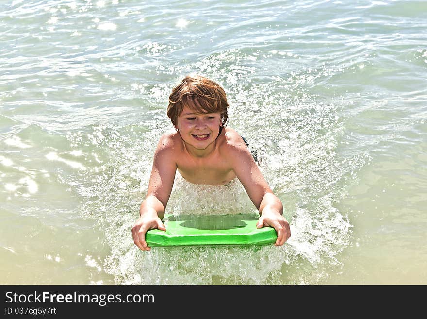 Boy has fun with the surfboard