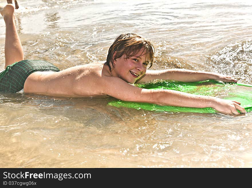 Boy has fun with the surfboard