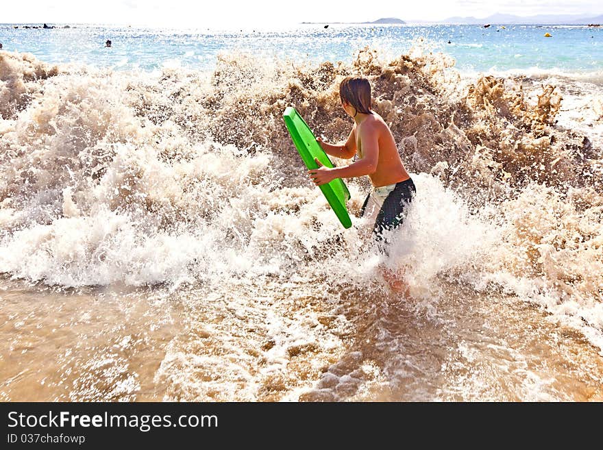 Boy has fun with the surfboard