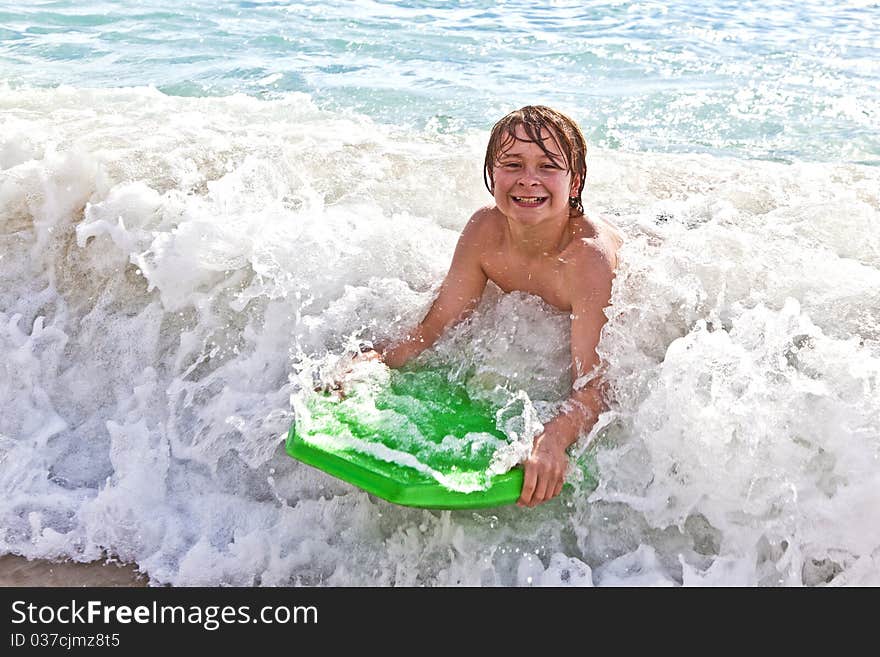 Boy has fun with the surfboard