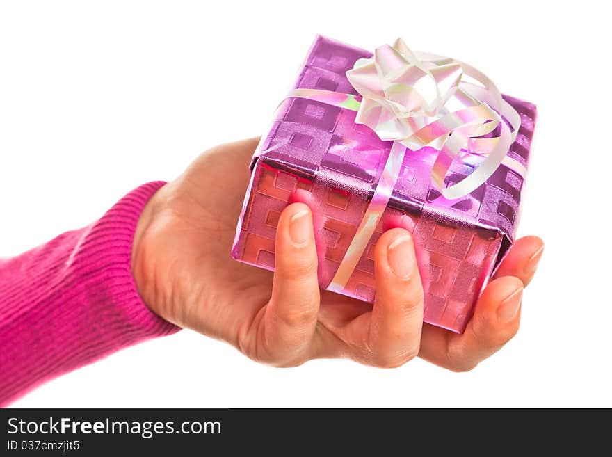 Hand holding pink gift on the white backround. Hand holding pink gift on the white backround.