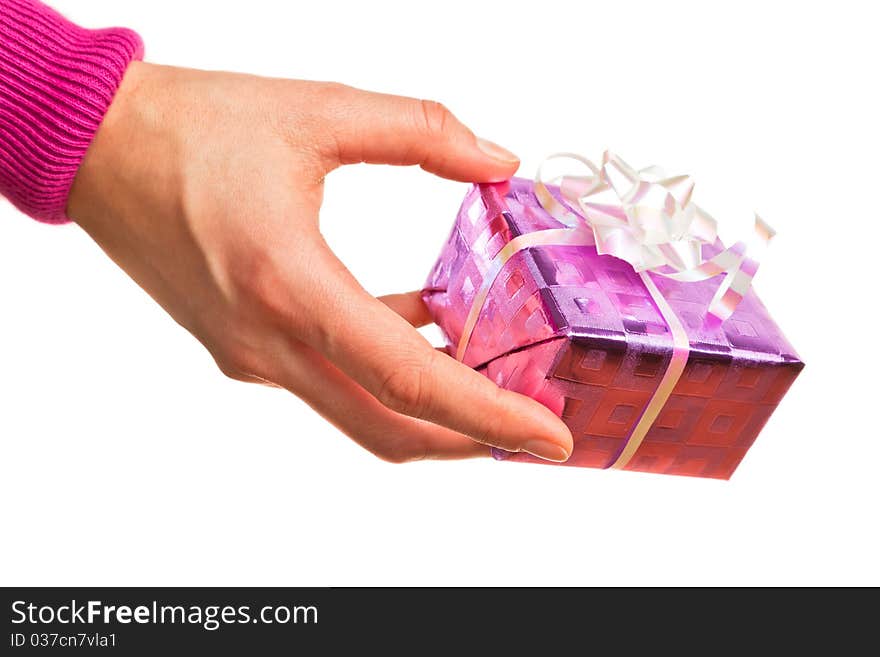 Hand holding pink gift on the white backround. Hand holding pink gift on the white backround.