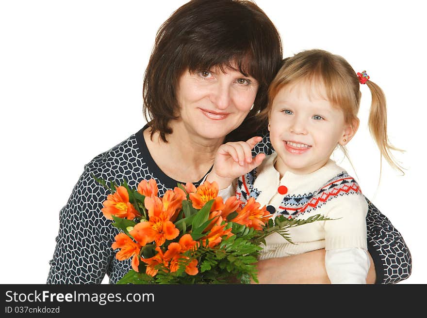 Grandmother And Granddaughter With Bunch Of Flower