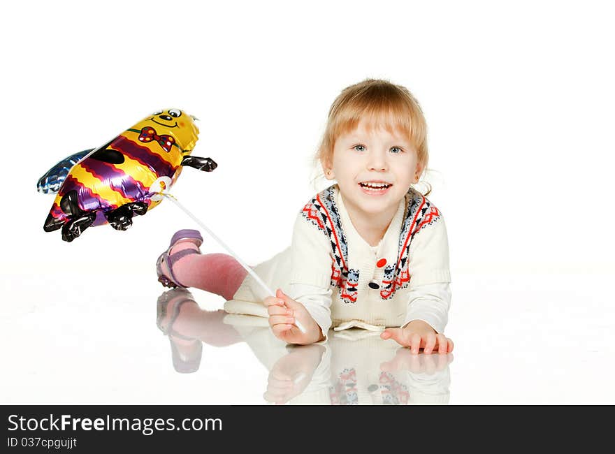 Kid Lying On The Floor With Balloon Bee