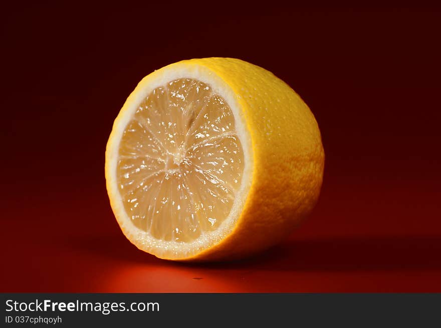 Fresh lemon on a red background