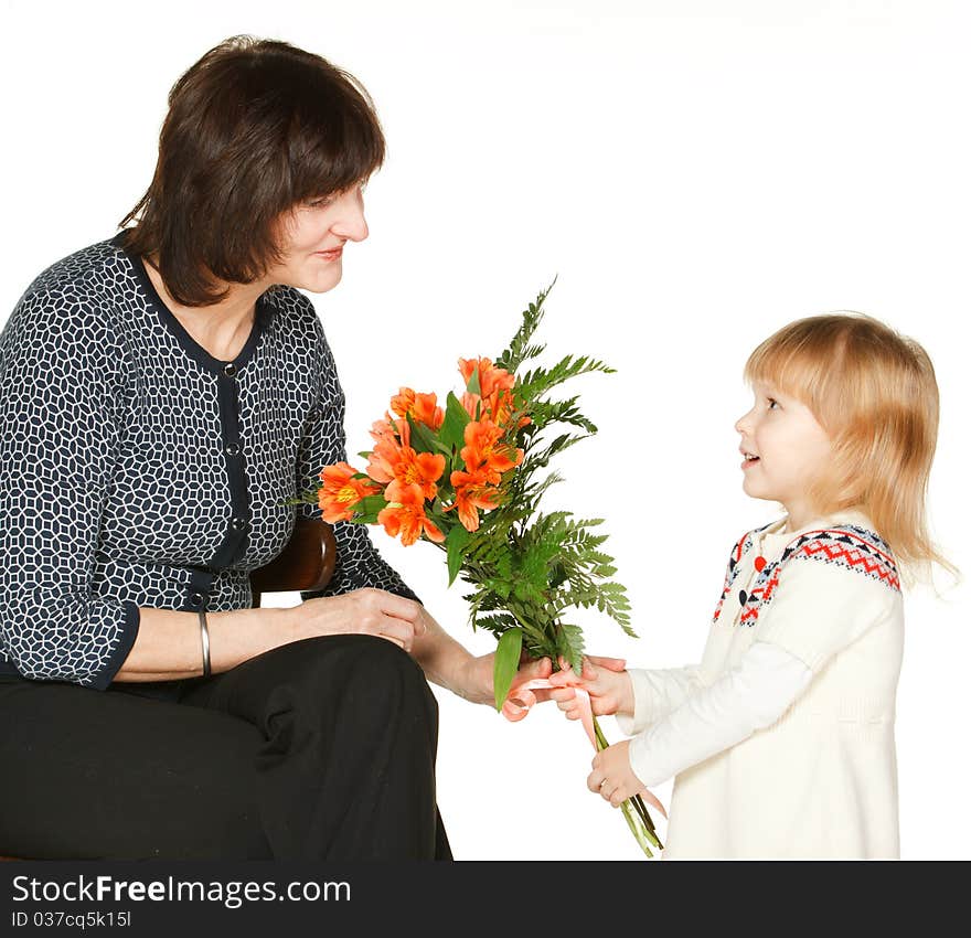 Granddaughter presenting bunch of flowers