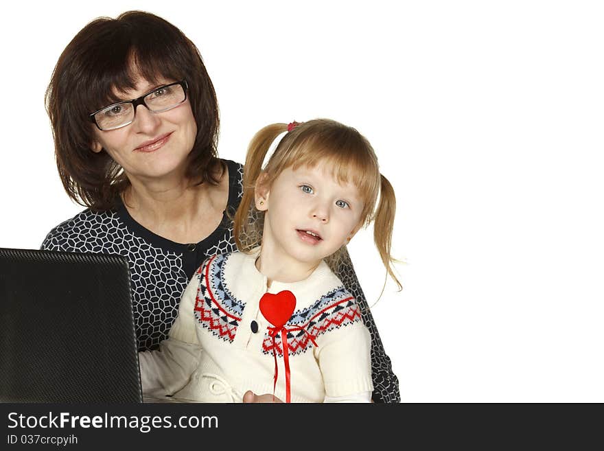 Grandmother and granddaughter with laptop