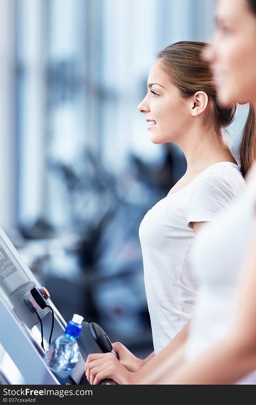 Young attractive woman in the fitness club. Young attractive woman in the fitness club