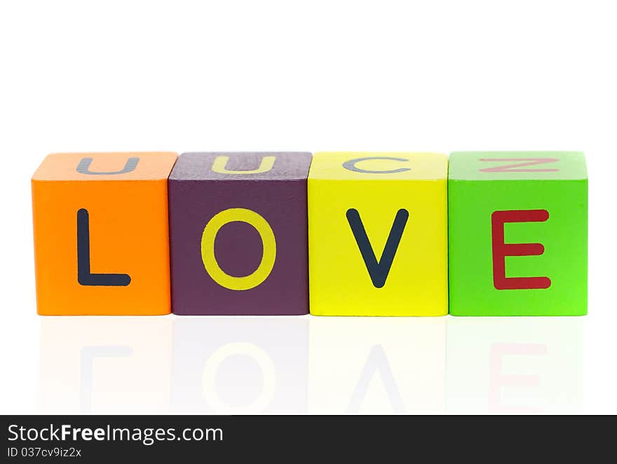 Love  - word formed with alphabet blocks isolated on a white background