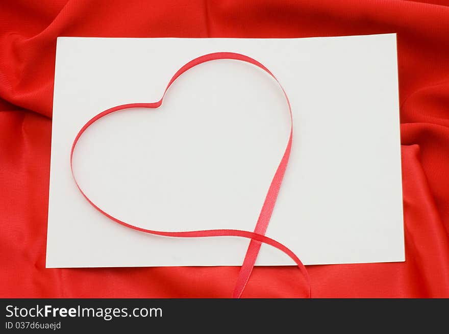 Pure sheet papers on a red fabric background