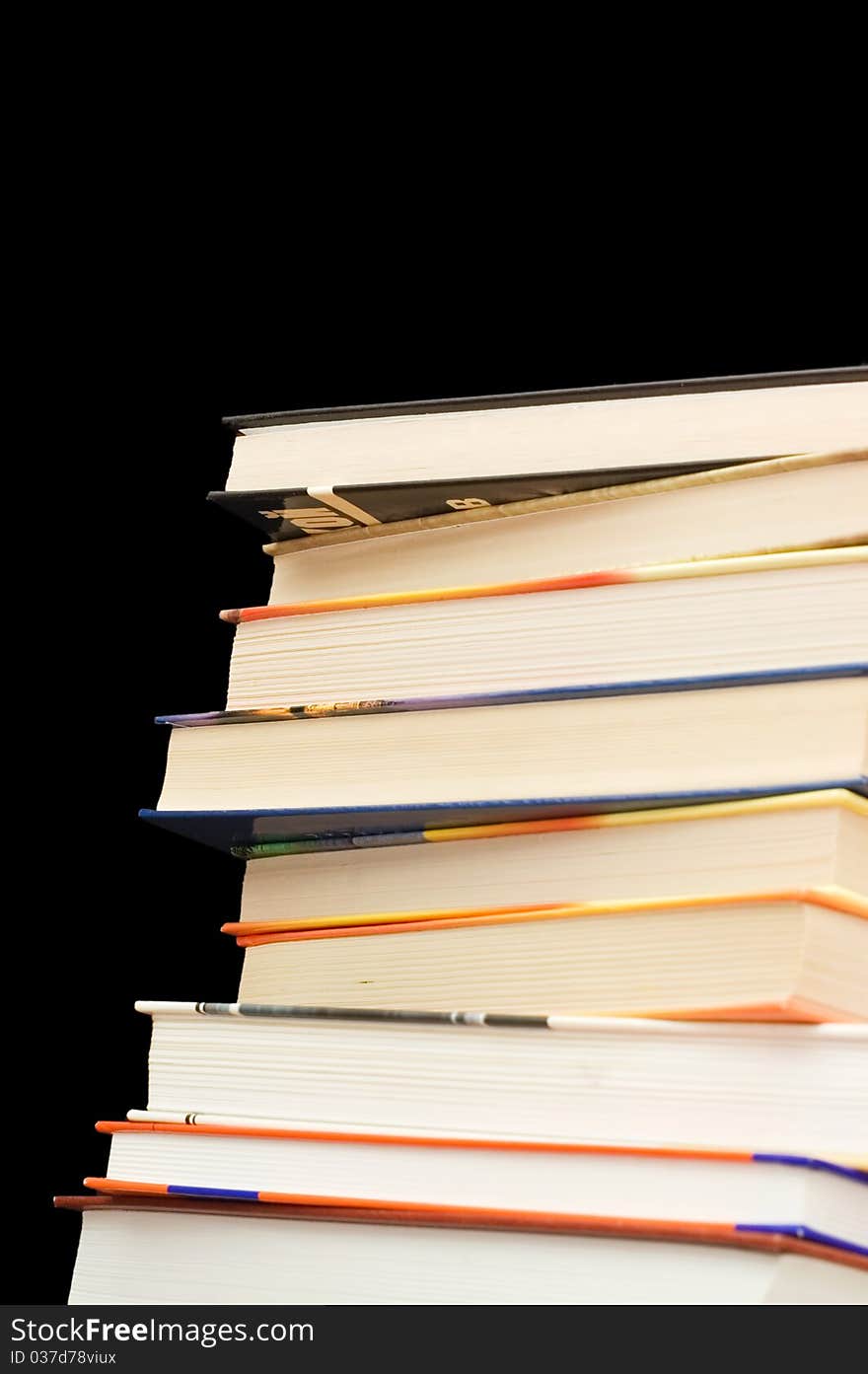 Pile of old books On a black background