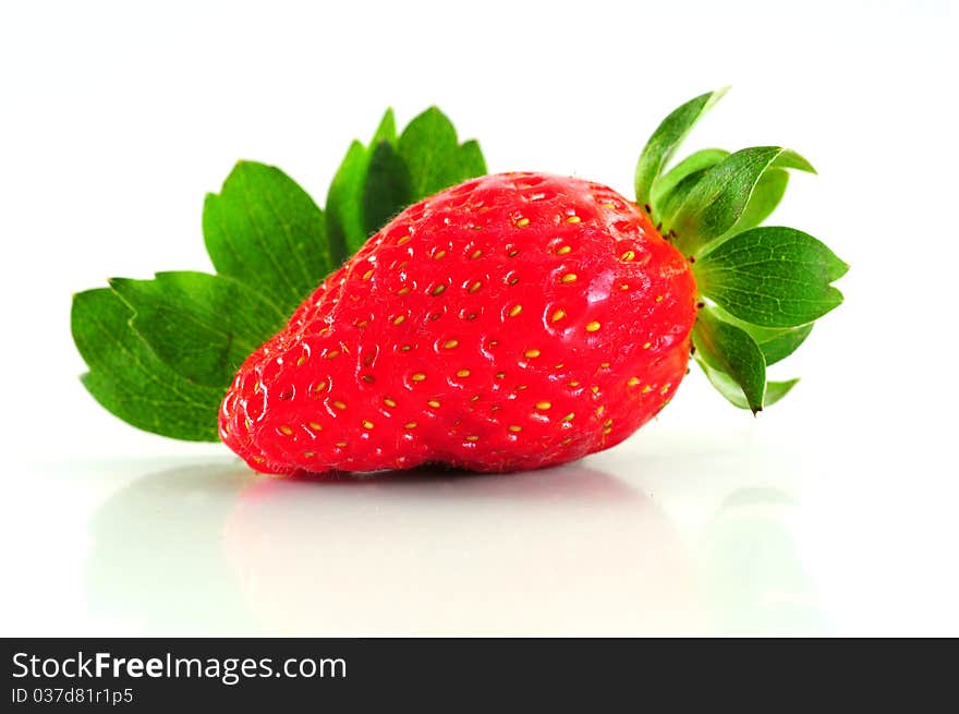 A fresh strawberry isolated on white background. A fresh strawberry isolated on white background.