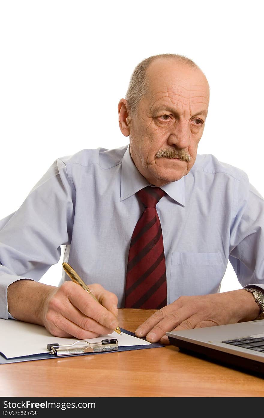 Businessman at the computer isolated on white background