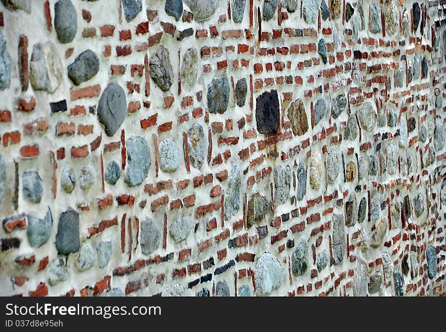 Old wall made out of bricks and stones. Old wall made out of bricks and stones