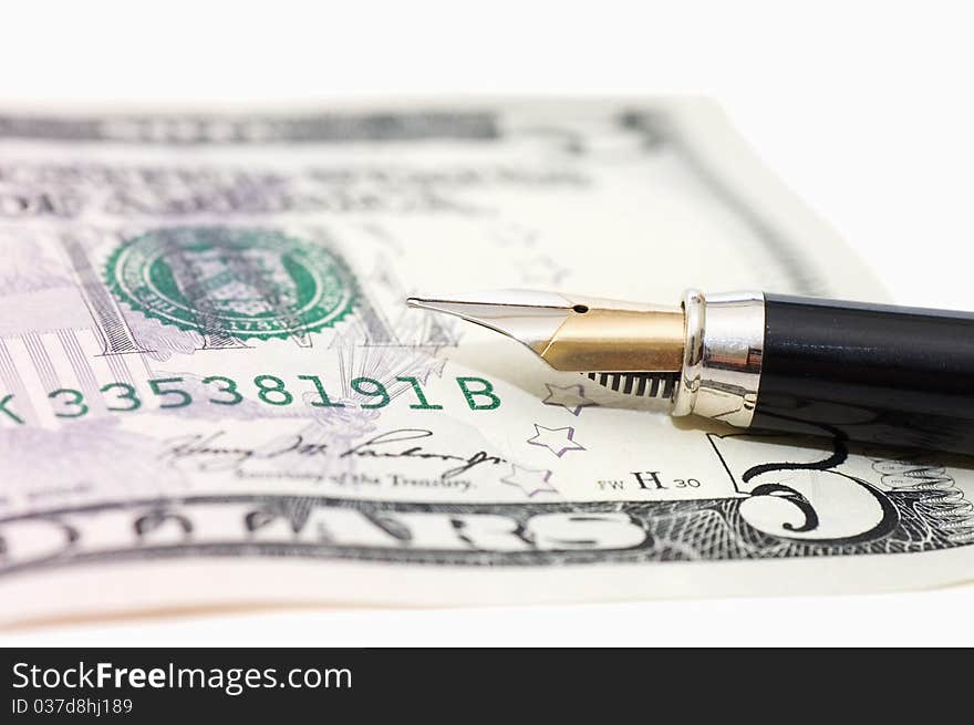 Dollar banknotes and pen