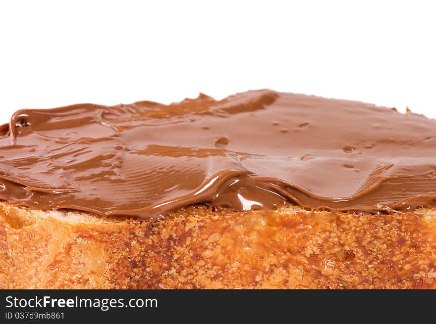 Fresh bread with chocolate paste close up