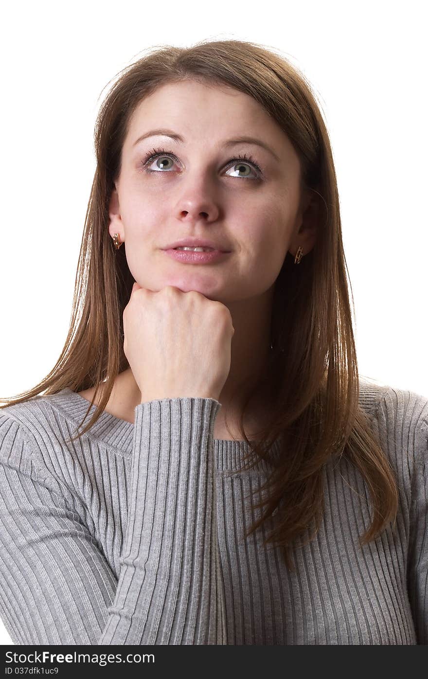 Young thinking woman in grey sweater isolated over white background