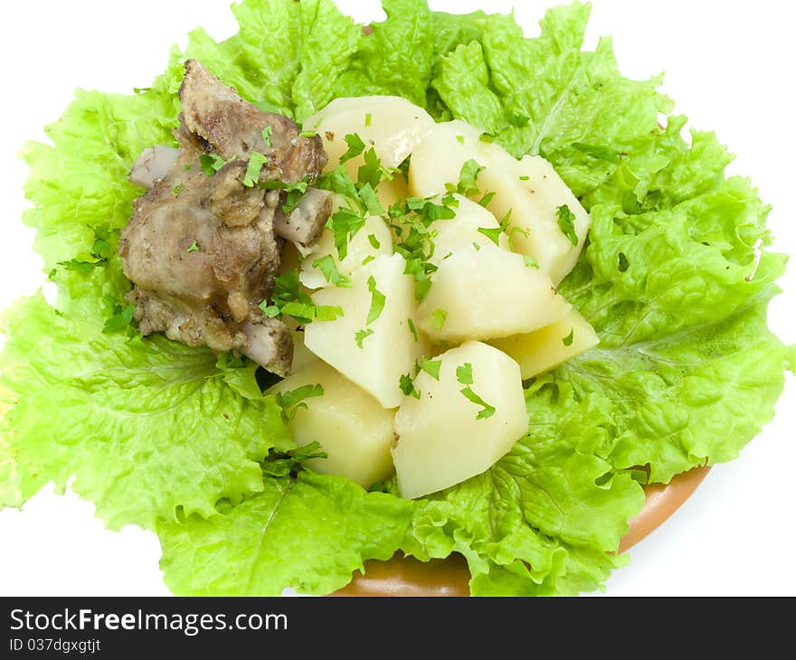 Boiled potatoes is found on brown plate, which is located on white background. Boiled potatoes is found on brown plate, which is located on white background