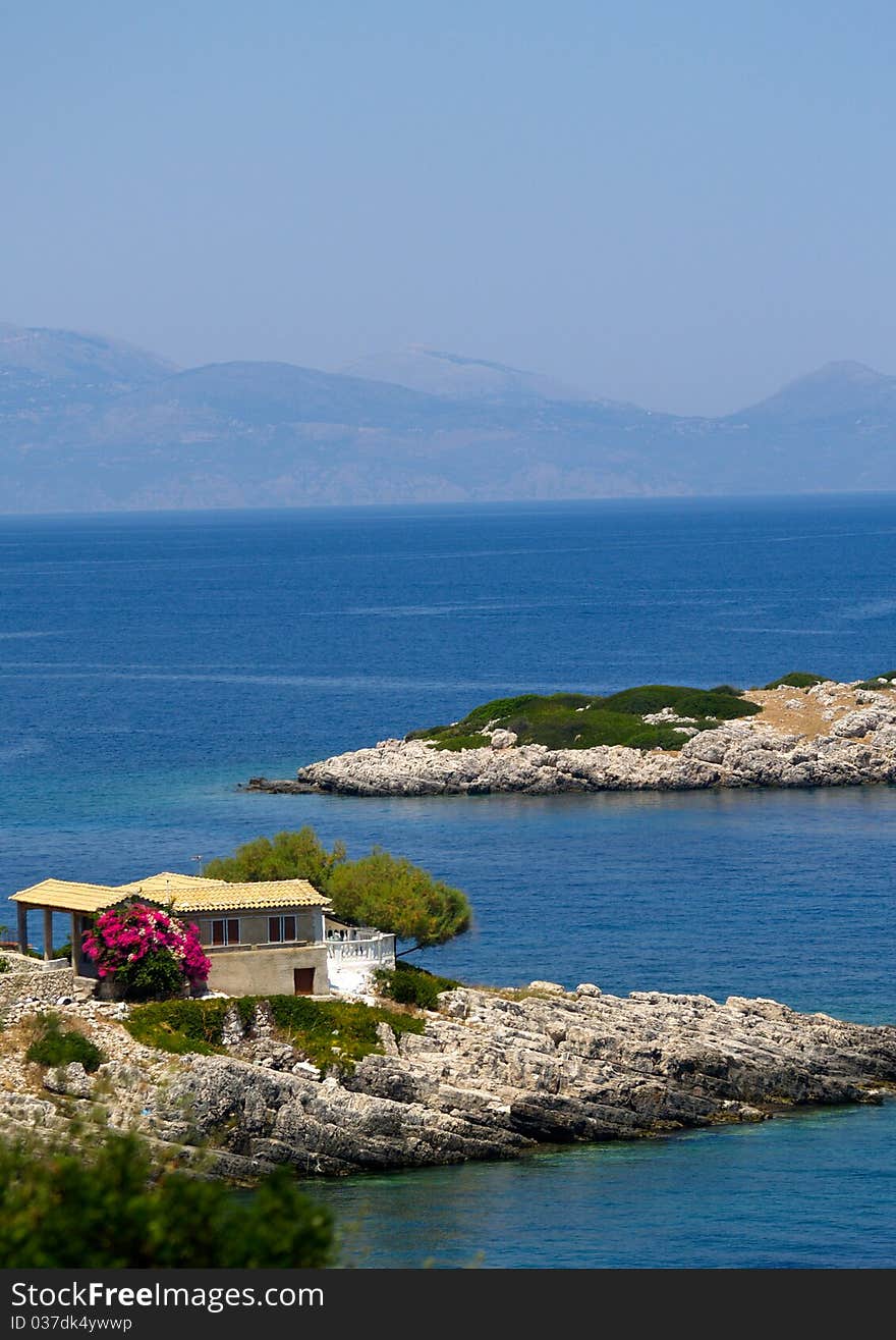 View of Greek Island with house and blue sea