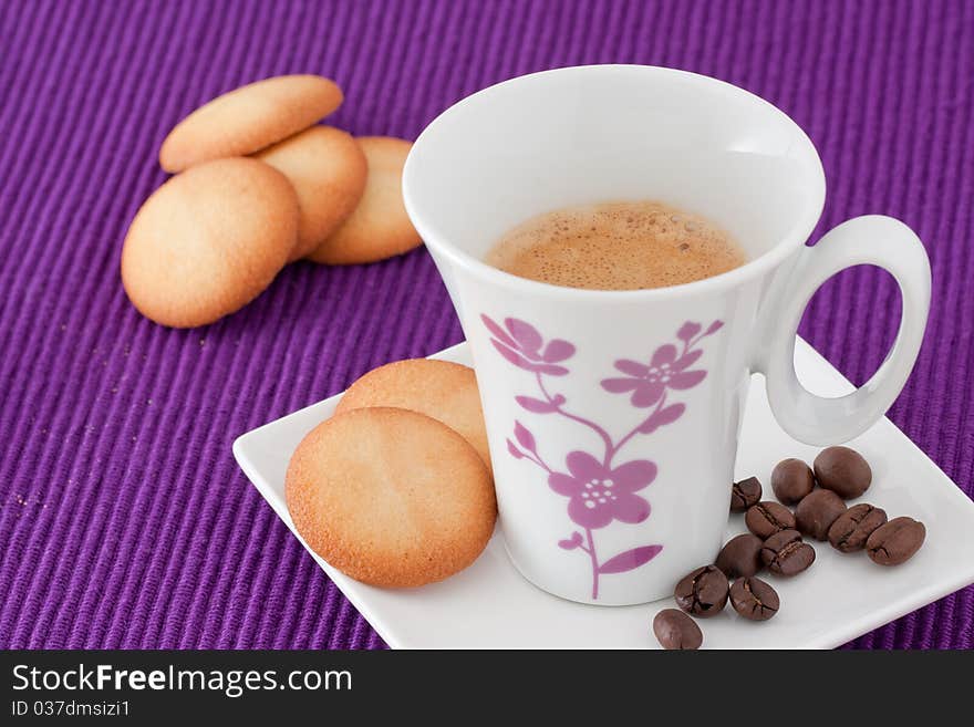 An elegant cup of coffee with biscuits. An elegant cup of coffee with biscuits