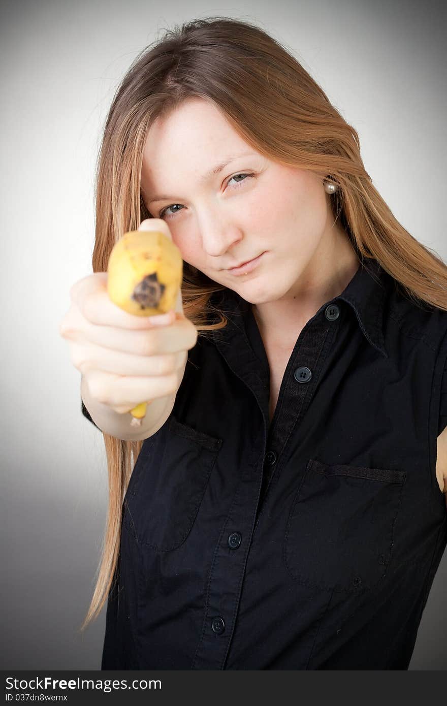 Image Of Girl Holds Banana As A Gun