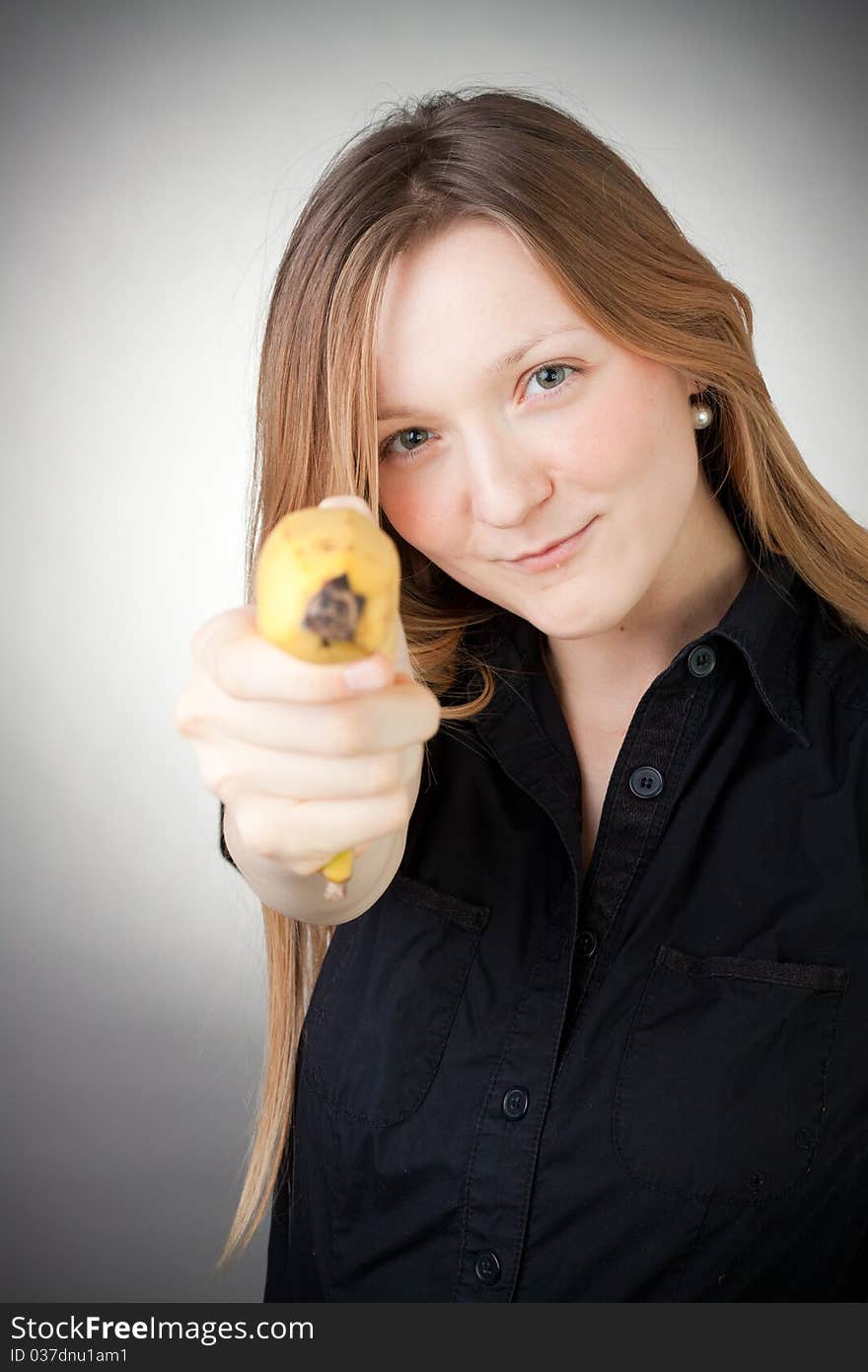 Image Of Girl Holds Banana As A Gun