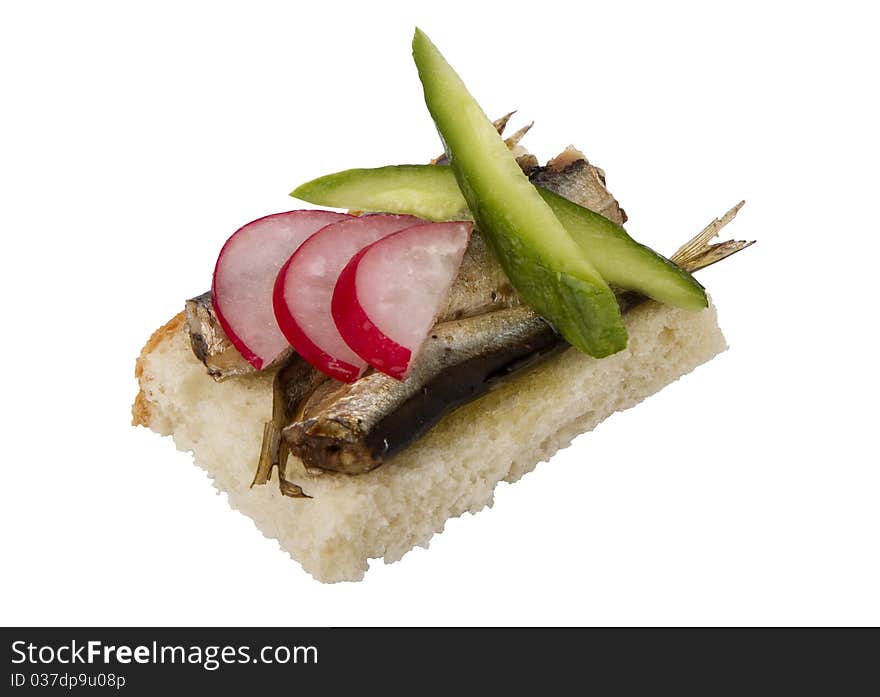 Danish open sandwich with sprats, radish and cucumber, on white bread.