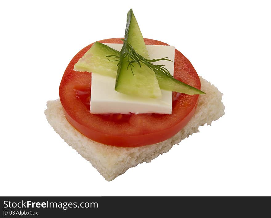 Danish open sandwich with tomato, cheese and cucumber, on white bread.