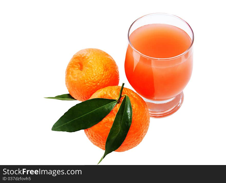 Glass of juice and two mandarins isolated on a white background