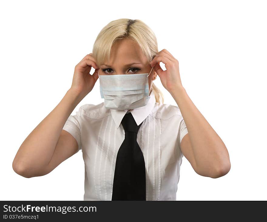 Blonde girl wearing surgical mask against white background. Blonde girl wearing surgical mask against white background.