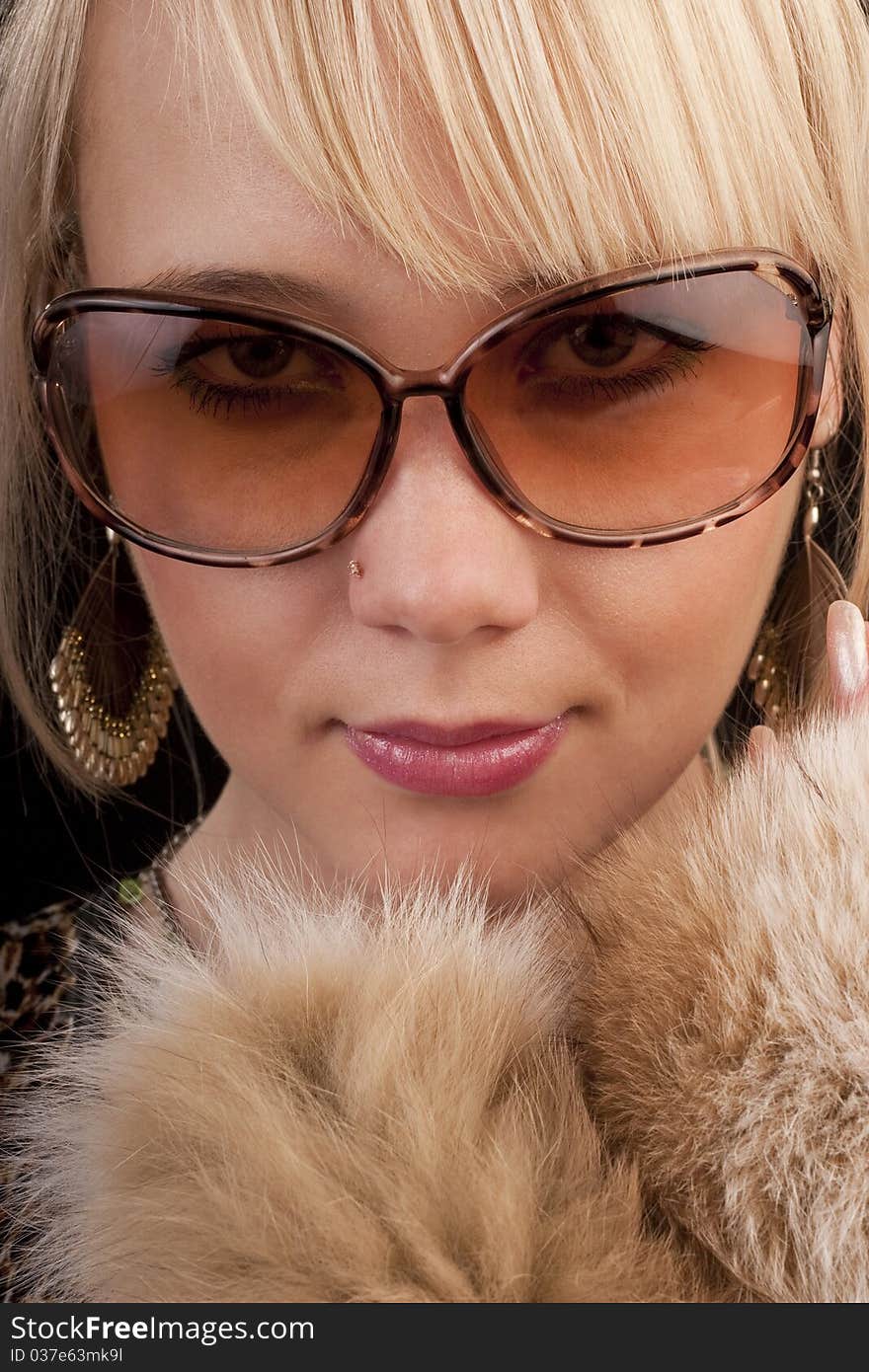 Girl in glasses posing to the camera