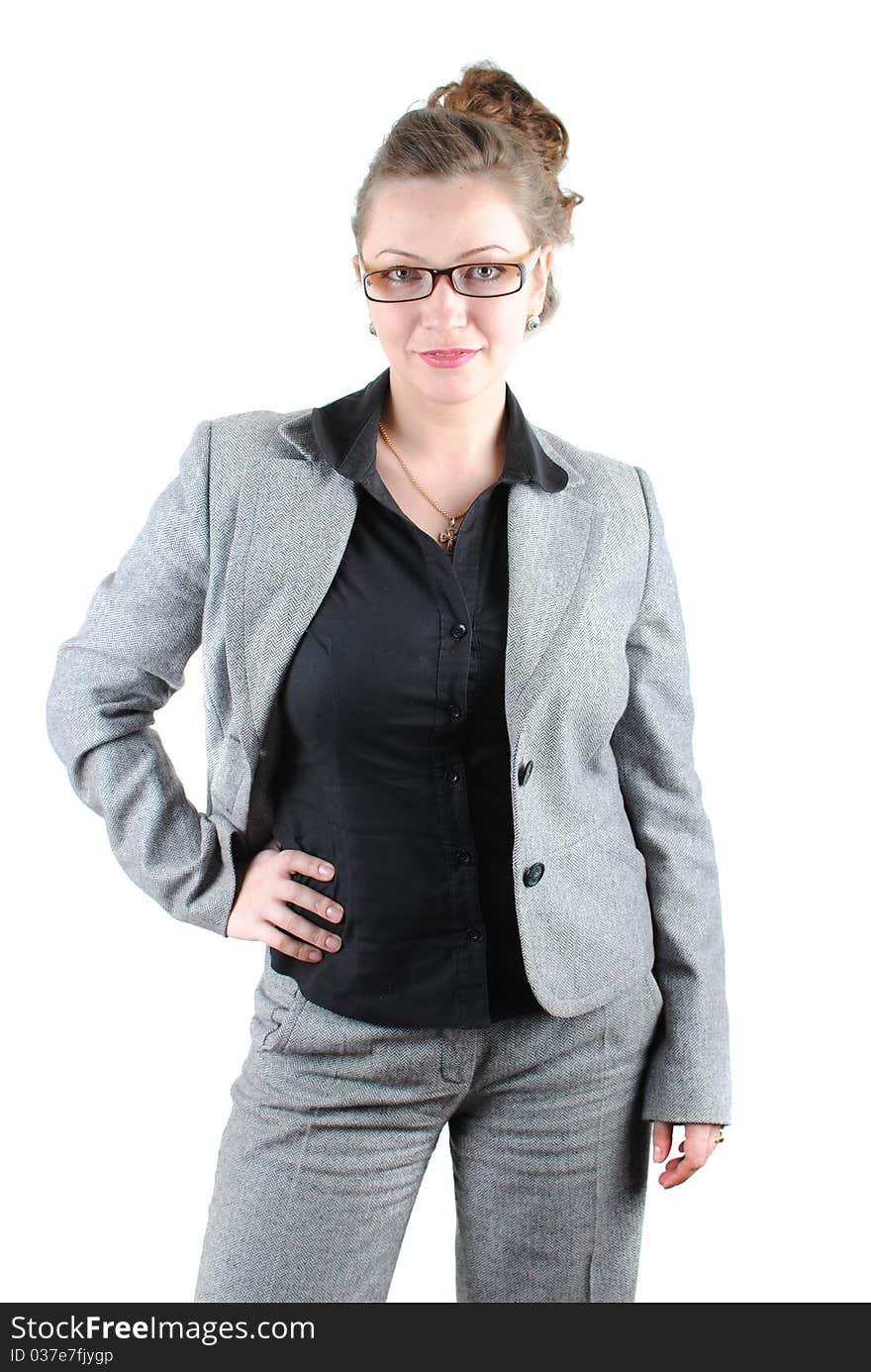 Beautiful young woman posing in business suit and glasses. Isolated over white background.