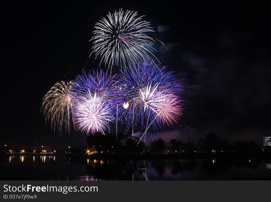 Bright and colorful fireworks exploding in the night sky. Bright and colorful fireworks exploding in the night sky