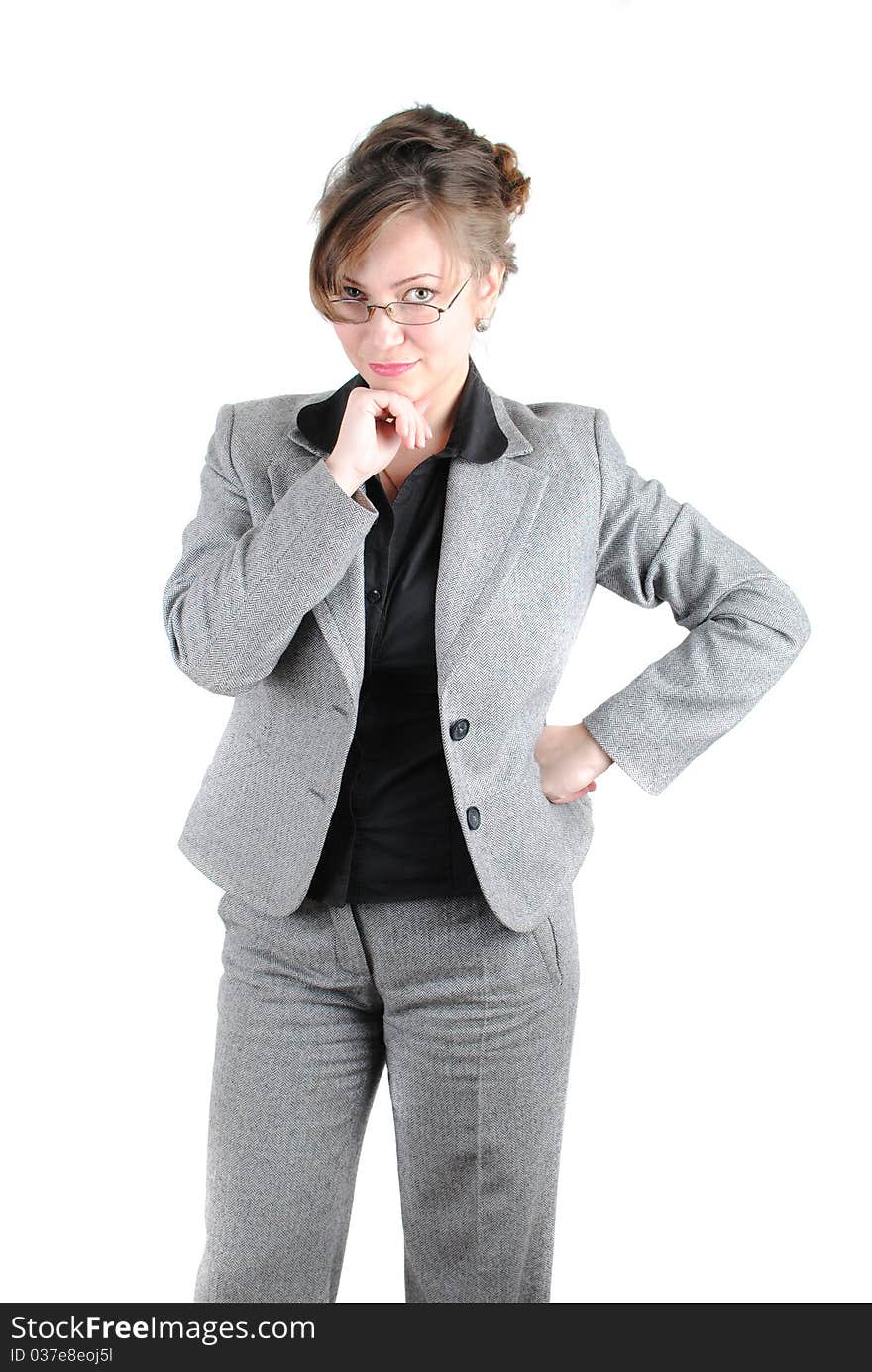 Beautiful young woman posing in business suit and glasses. Isolated over white background.