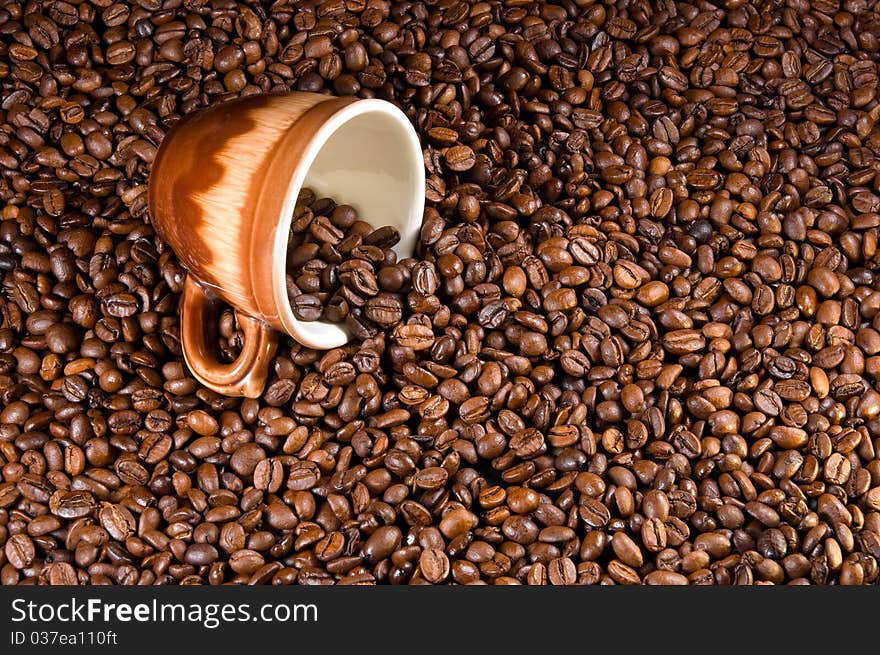 Fragrant coffee beans and cup. Fragrant coffee beans and cup.