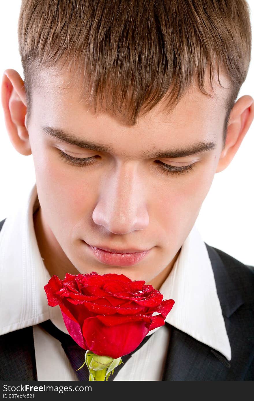 Man smelling a rose. Isolated