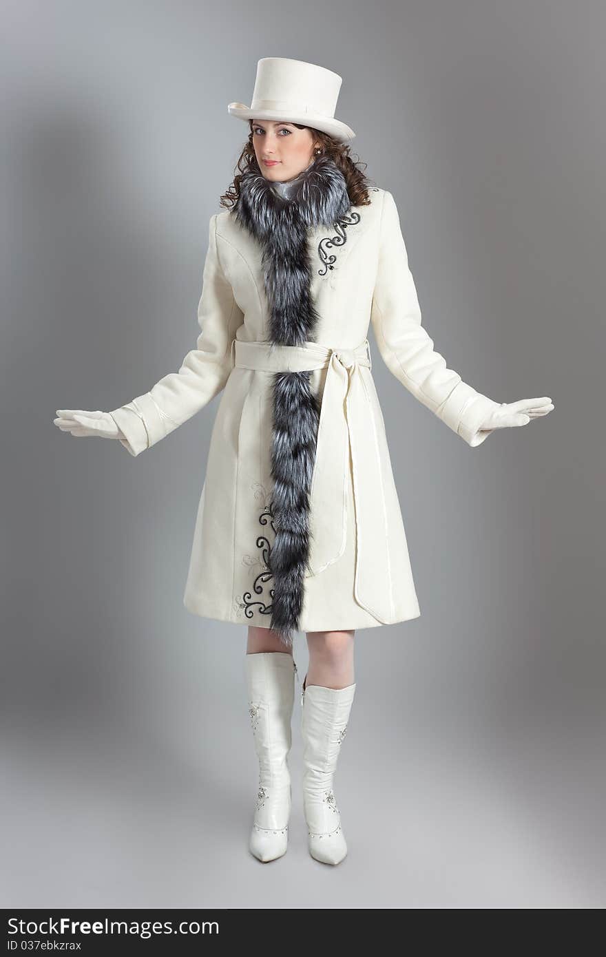 Girl in fur coat posing