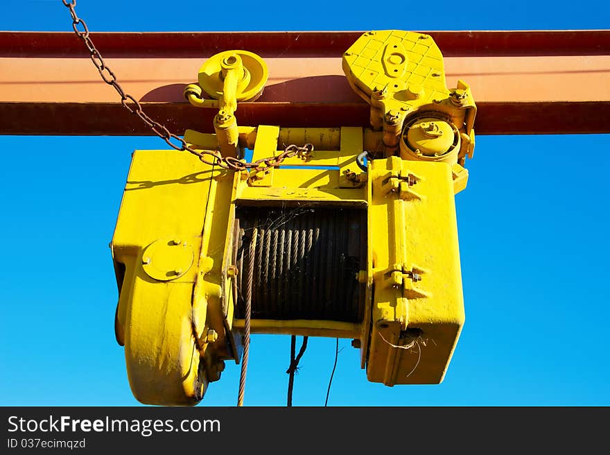 Old yellow crab against the blue sky