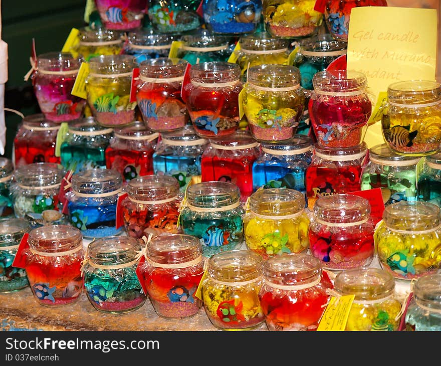 Many candles on a shelf