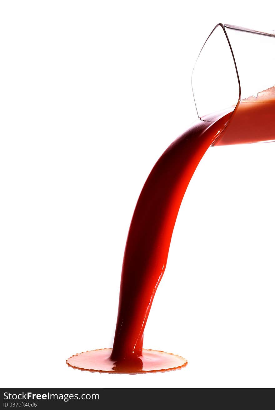 Tomato juice splash in glass white background